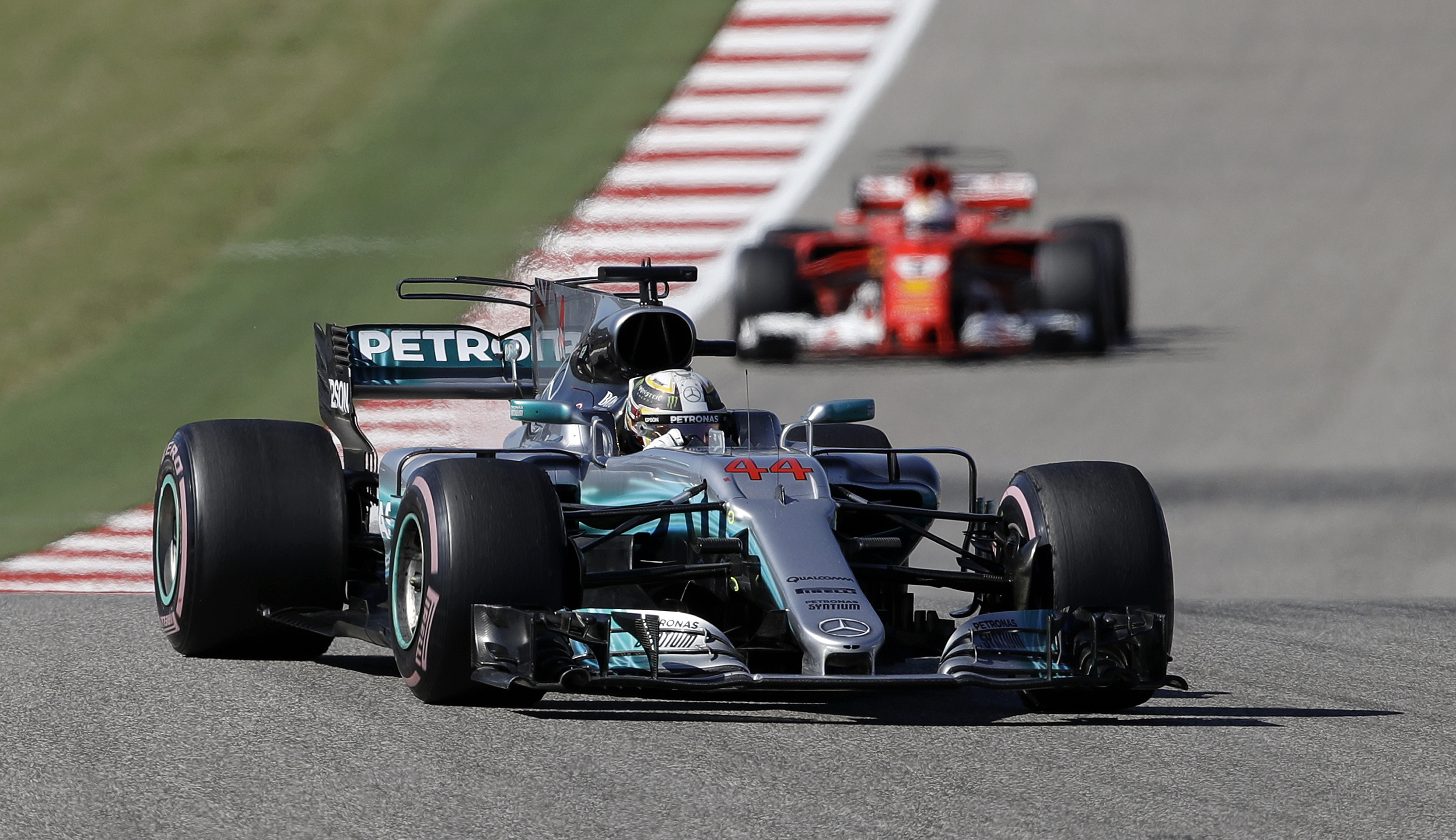 Mercedes driver Lewis Hamilton, of Britain, comes through a turn during the Formula One U.S. Grand Prix auto race at the Circuit of the Americas- AP